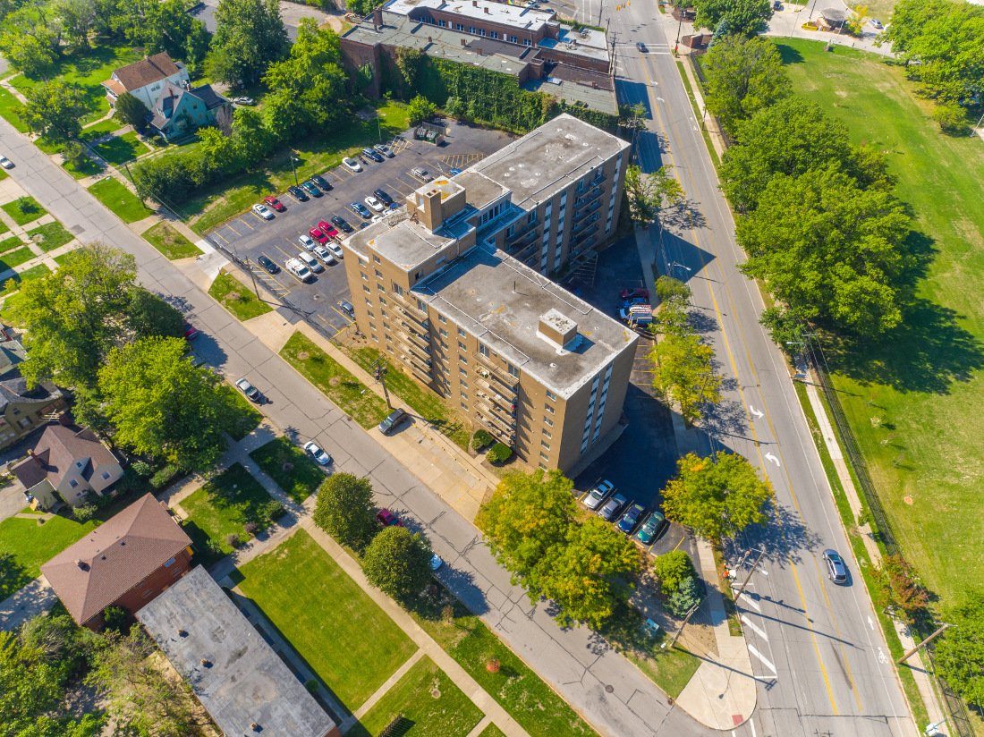 Aerial view over a Cleveland lakefront neighbourhood with a mid-rise apartment building.